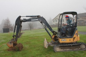 Chuck Cox is allowed to break the ground for the Angel Statue site, with the cerimonial First Shovel of dirt...er...sod. (it was easier then actually using a shovel)